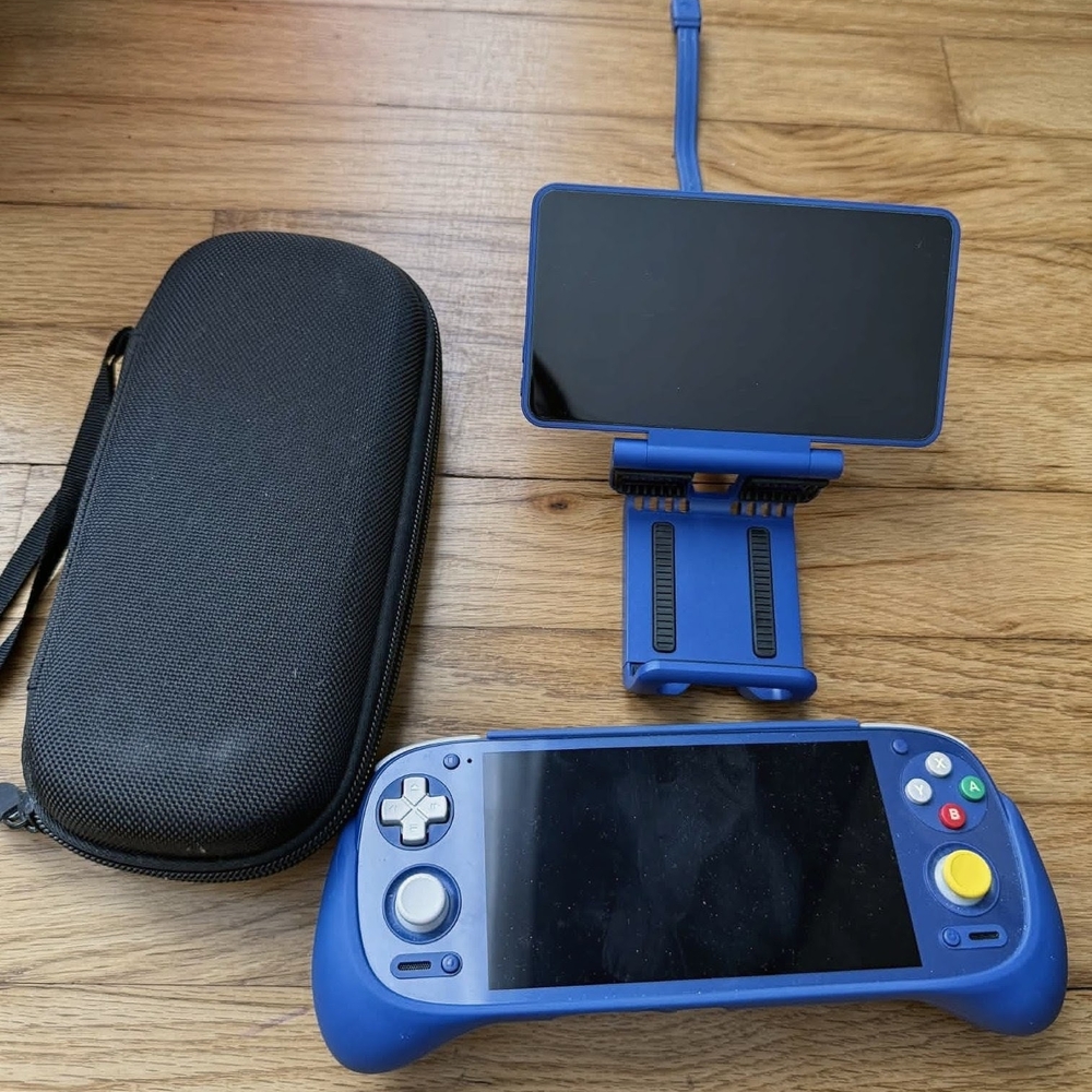 Blue Handheld Gaming Console with Stand and Case